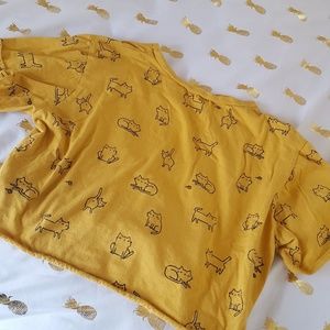 Yellow cropped shirt cats on it